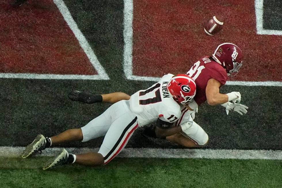 Georgia's Nakobe Dean breaks up a pass intended for Alabama's Cameron Latu during the first hal ...