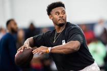 Liberty quarterback Malik Willis runs through passing drills during Liberty Football Pro Day in ...