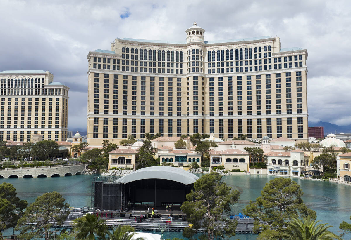 Workers install the red carpet stage on the Bellagio Fountains on Friday, April 22, 2022, in La ...