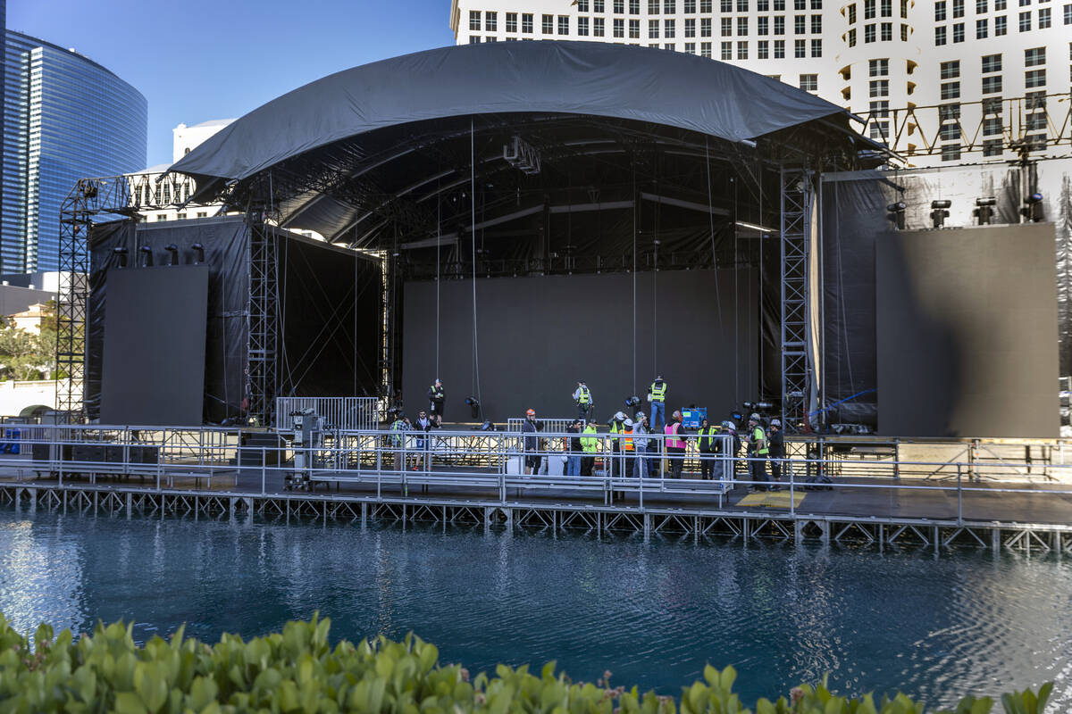 Crews continue with preparations for the NFL Draft 2022 stage at the Bellagio Fountains on Satu ...