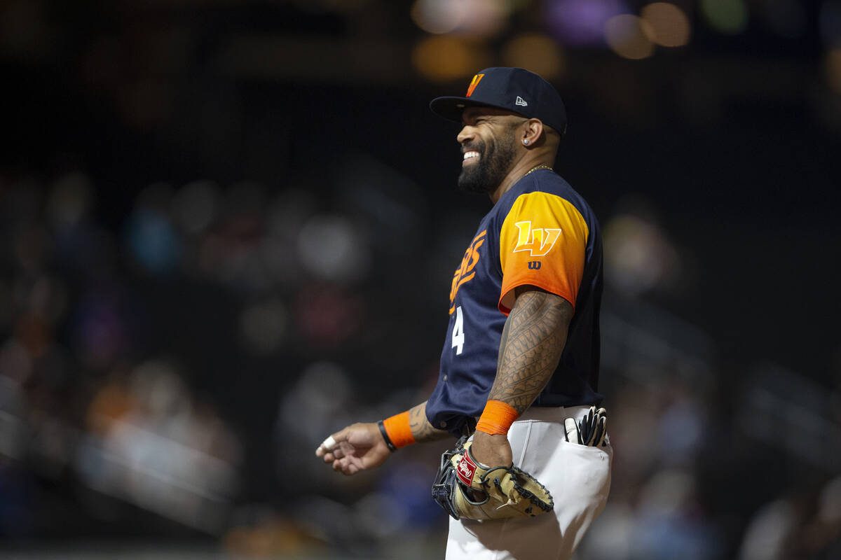 Las Vegas Aviators first baseman Eric Thames (4) laughs during a Minor League Baseball game aga ...