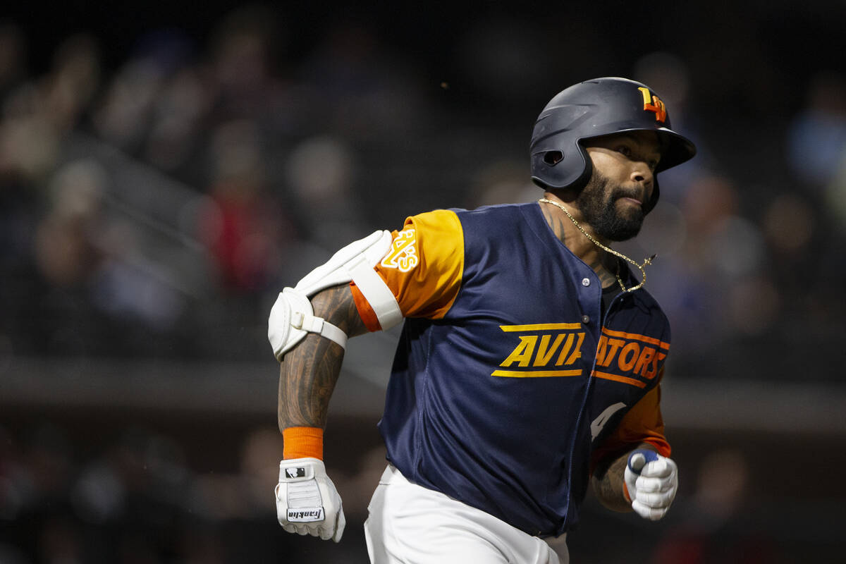 Las Vegas Aviators slugger Eric Thames (4) rounds first base during a Minor League Baseball gam ...