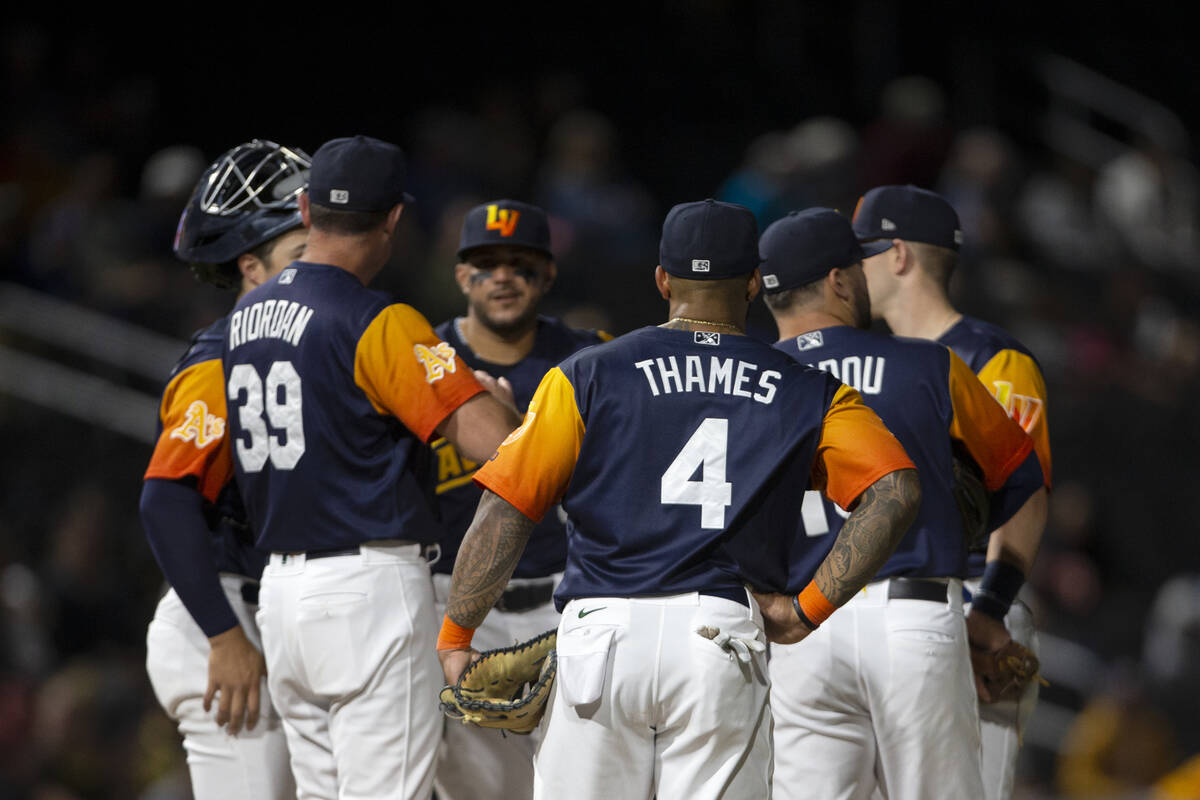 Las Vegas Aviators first baseman Eric Thames (4) participates in a huddle at the pitcher&#x2019 ...