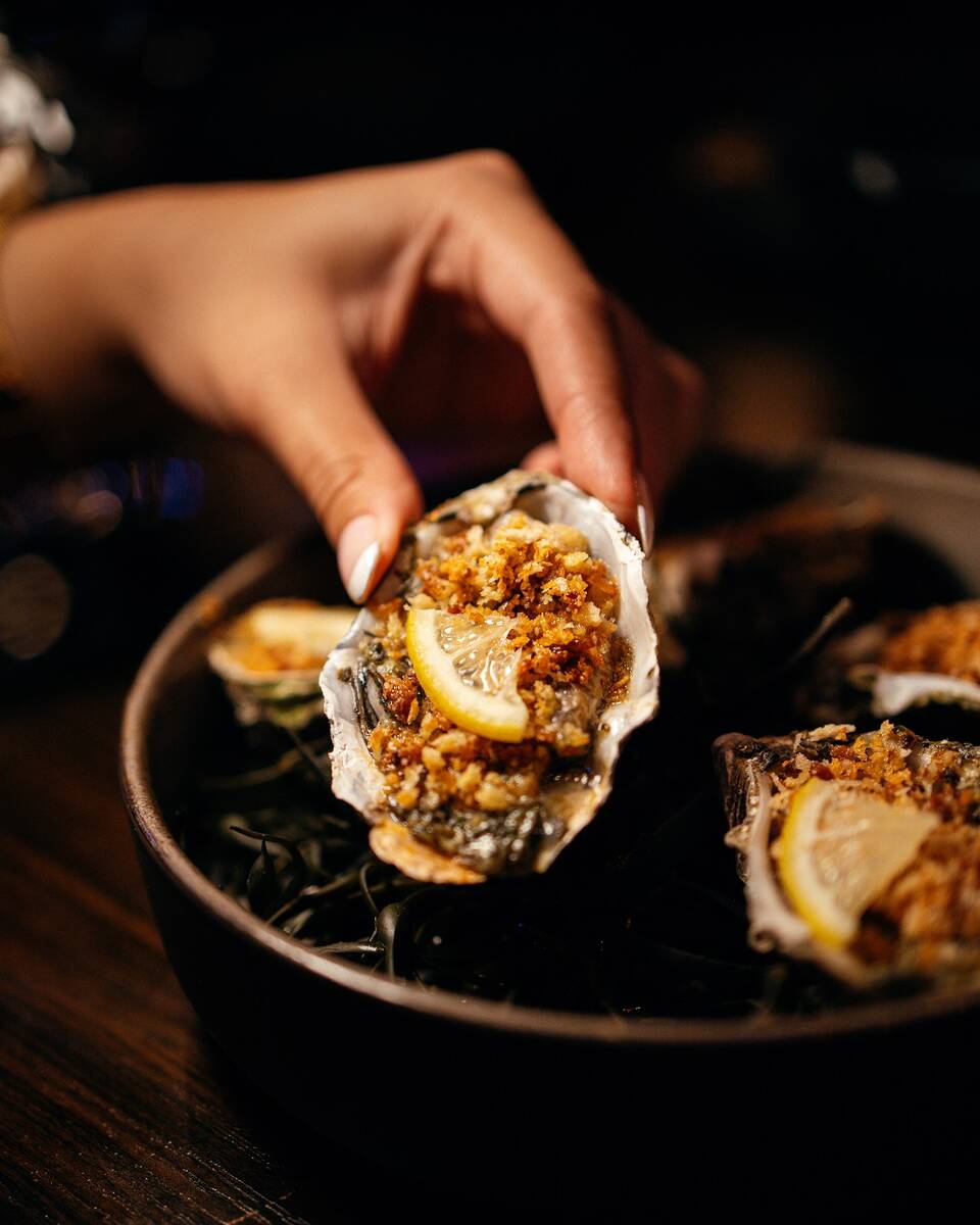 Oysters grilled over charcoal are among the starters from the brunch menu being served for Moth ...