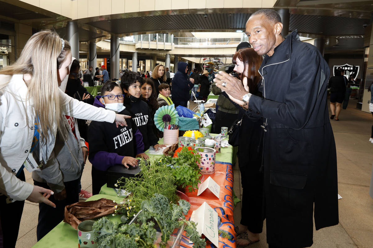 United Way of Southern Nevada CEO and President Julian High, right, stands by the booth of Roun ...