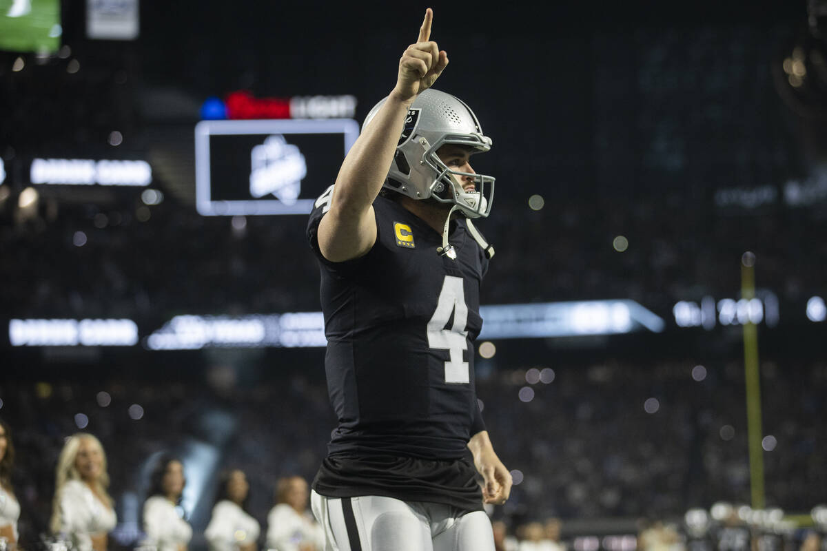 Raiders quarterback Derek Carr (4) is introduced before the start of an NFL football game again ...