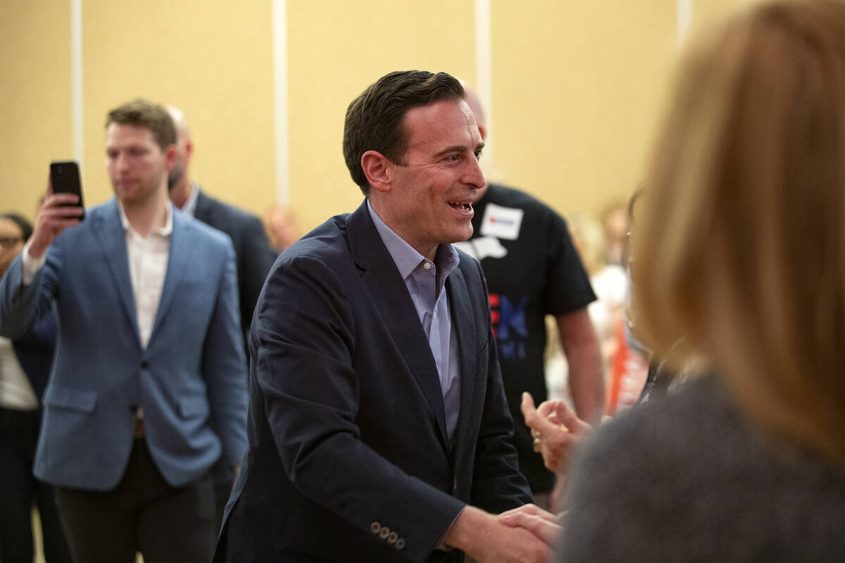 Nevada Republican U.S. Senate candidate Adam Laxalt shakes the hands of attendees during a rall ...