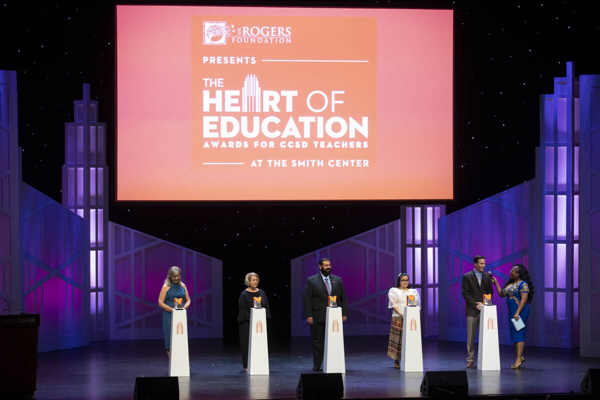 Scott Panik, second from right, teacher at Green Valley High School, is interviewed by emcee Mo ...