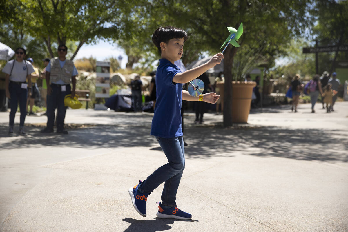 Siblings Joonhee Shin, 7, plays during an Earth Day celebration at Springs Preserve in Las Vega ...