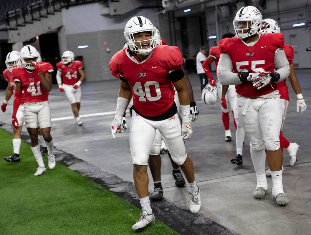 UNLV Rebels linebacker Dondi Fuller (40) and defensive lineman Tavis Malakius (55) celebrate wi ...