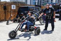 Clark County School District police officer Aaron Case helps Maria Silva attempt a driving into ...