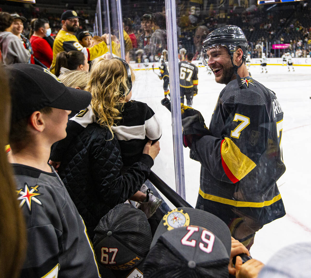 Golden Knights defenseman Alex Pietrangelo (7) visits his family while warming up before playin ...