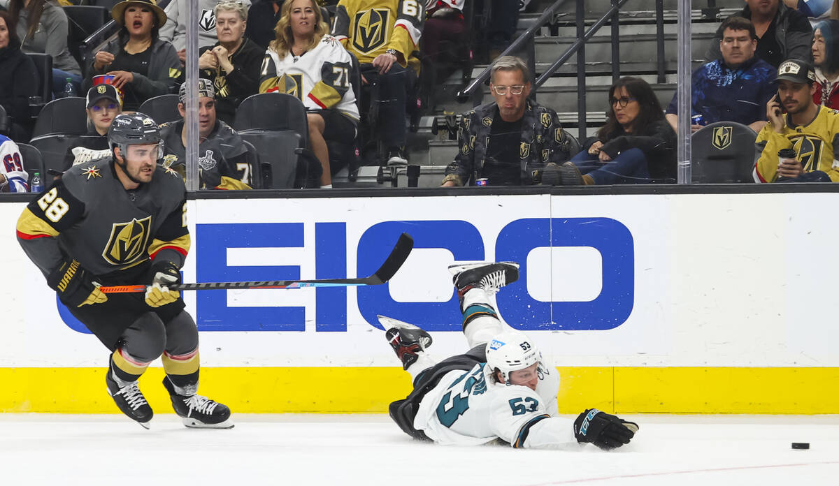 San Jose Sharks defenseman Nicolas Meloche (53) gets tripped up in front of Golden Knights left ...