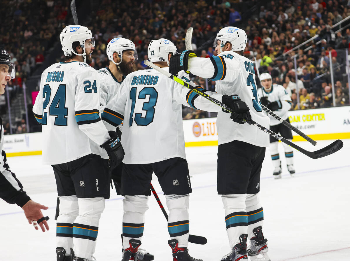 The San Jose Sharks celebrate after scoring against the Golden Knights during the second period ...