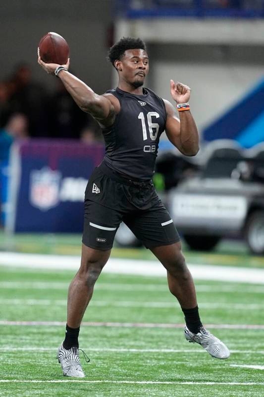 Liberty quarterback Malik Willis runs a drill during the NFL football scouting combine, Thursda ...