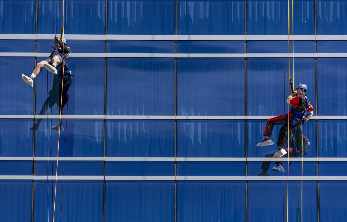 Rappellers Josh Crame with WestPac Wealth Partners, left, and Taylor Barton with the Las Vegas ...