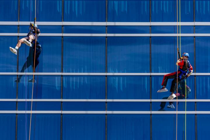 Rappellers Josh Crame with WestPac Wealth Partners, left, and Taylor Barton with the Las Vegas ...