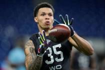 North Dakota State wide receiver Christian Watson catches a pass during a drill at the NFL foot ...