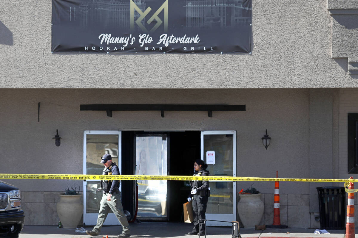 Las Vegas police investigate at Manny's Glow Ultra Lounge & Restaurant, after a shooting, S ...
