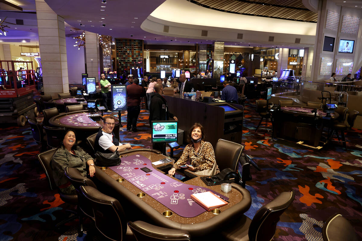 Table games dealers, from left, Mila Aspiras, Ahmo Kovacevic and Fahima Quassani practice at th ...