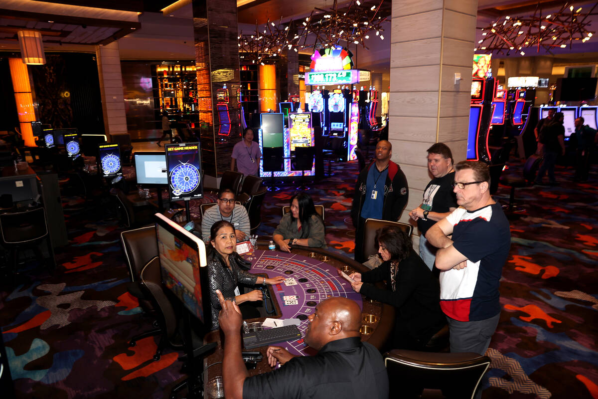 Table games dealers practice at the Palms in Las Vegas Monday, April 25, 2022. The 766-room off ...