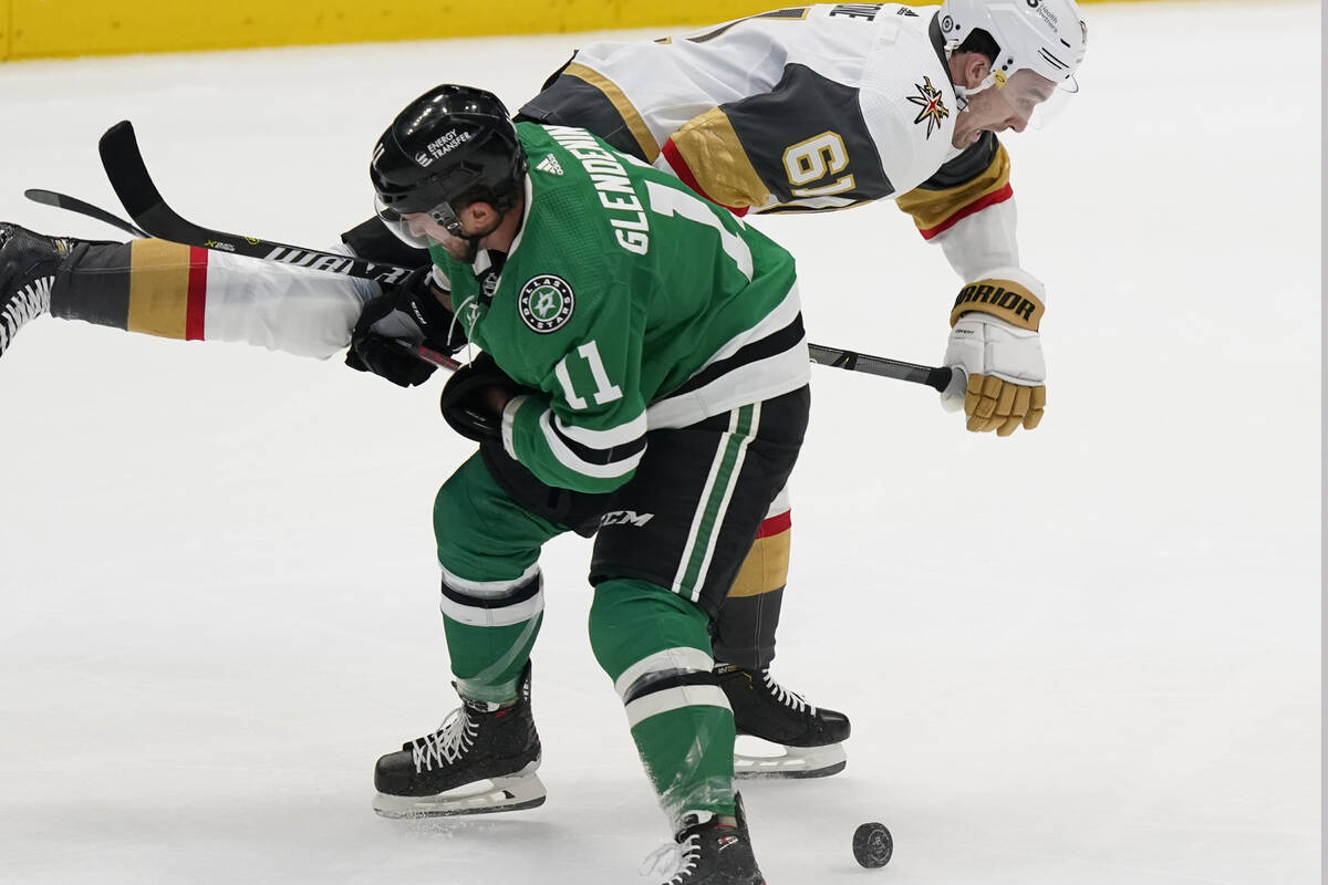 Dallas Stars center Luke Glendening (11) tries keep Vegas Golden Knights right wing Mark Stone ...