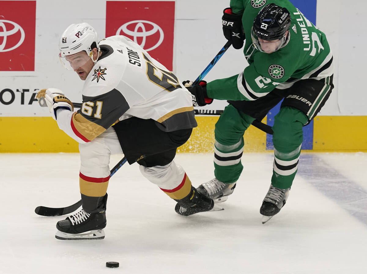 Vegas Golden Knights right wing Mark Stone (61) and Dallas Stars defenseman Esa Lindell (23) ch ...