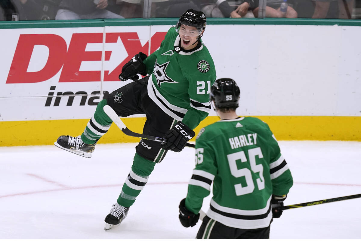 Dallas Stars left wing Jason Robertson (21) celebrates his goal with Thomas Harley (55) during ...