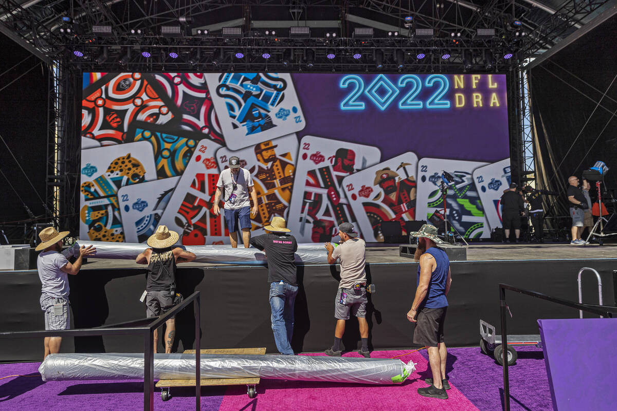Workers continue to build the NFL Draft Red Carpet Stage at the Bellagio Fountains on Tuesday, ...