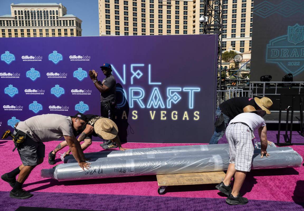 Workers continue to build the NFL Draft Red Carpet Stage at the Bellagio Fountains on Tuesday, ...