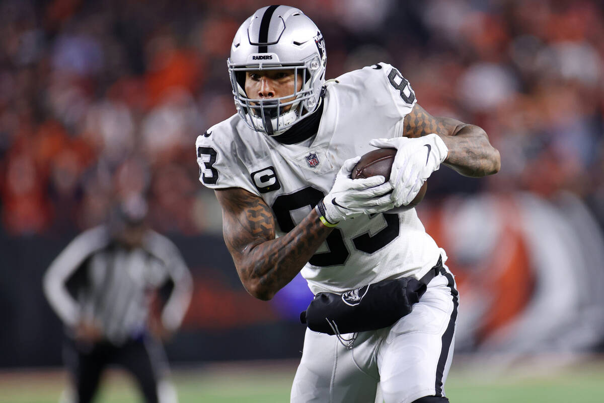In this Jan. 15, 2022, file photo, Raiders tight end Darren Waller (83) makes a catch against t ...
