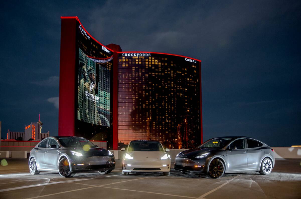 Teslas are parked outside Resorts World Las Vegas. EVolve Car Rentals partnered with the resort ...