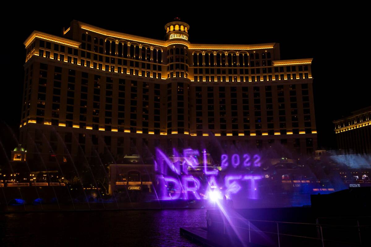 Images are displayed in the NFL fountain projection show at the Bellagio Fountains on Wednesday ...