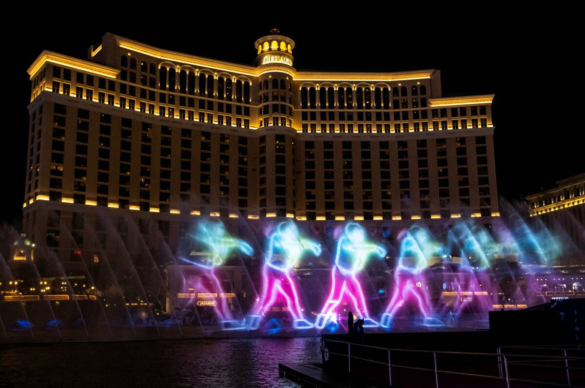 Images are displayed in the NFL fountain projection show at the Bellagio Fountains on Wednesday ...