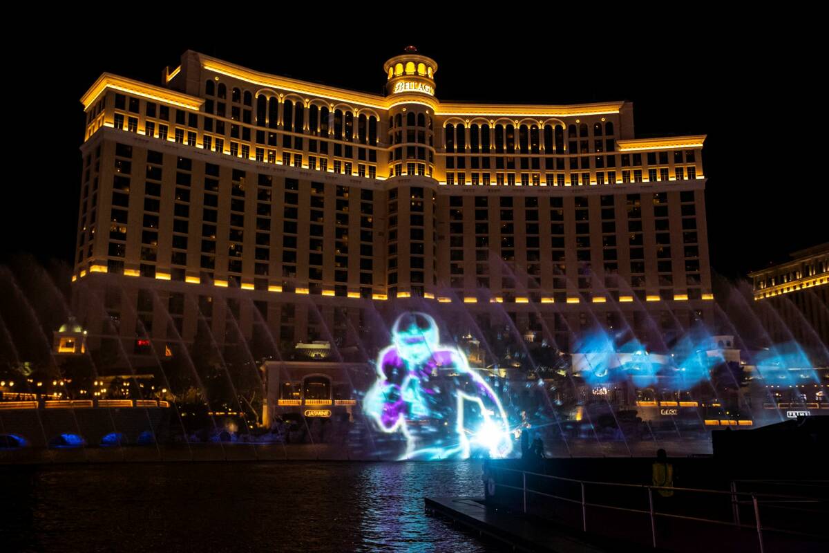 Images are displayed in the NFL fountain projection show at the Bellagio Fountains on Wednesday ...
