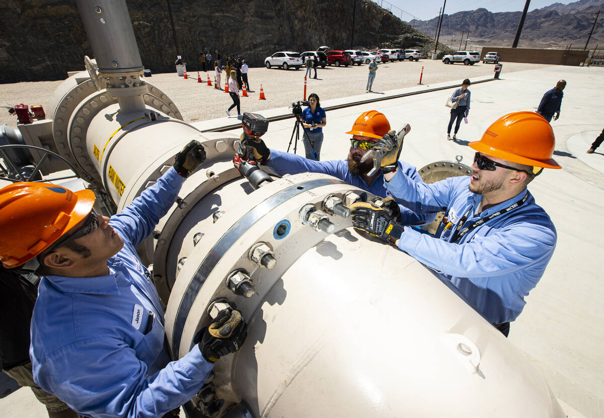 Southern Nevada Water Authority maintenance mechanics, from left, Jason Dondoy, Patrick Smith a ...