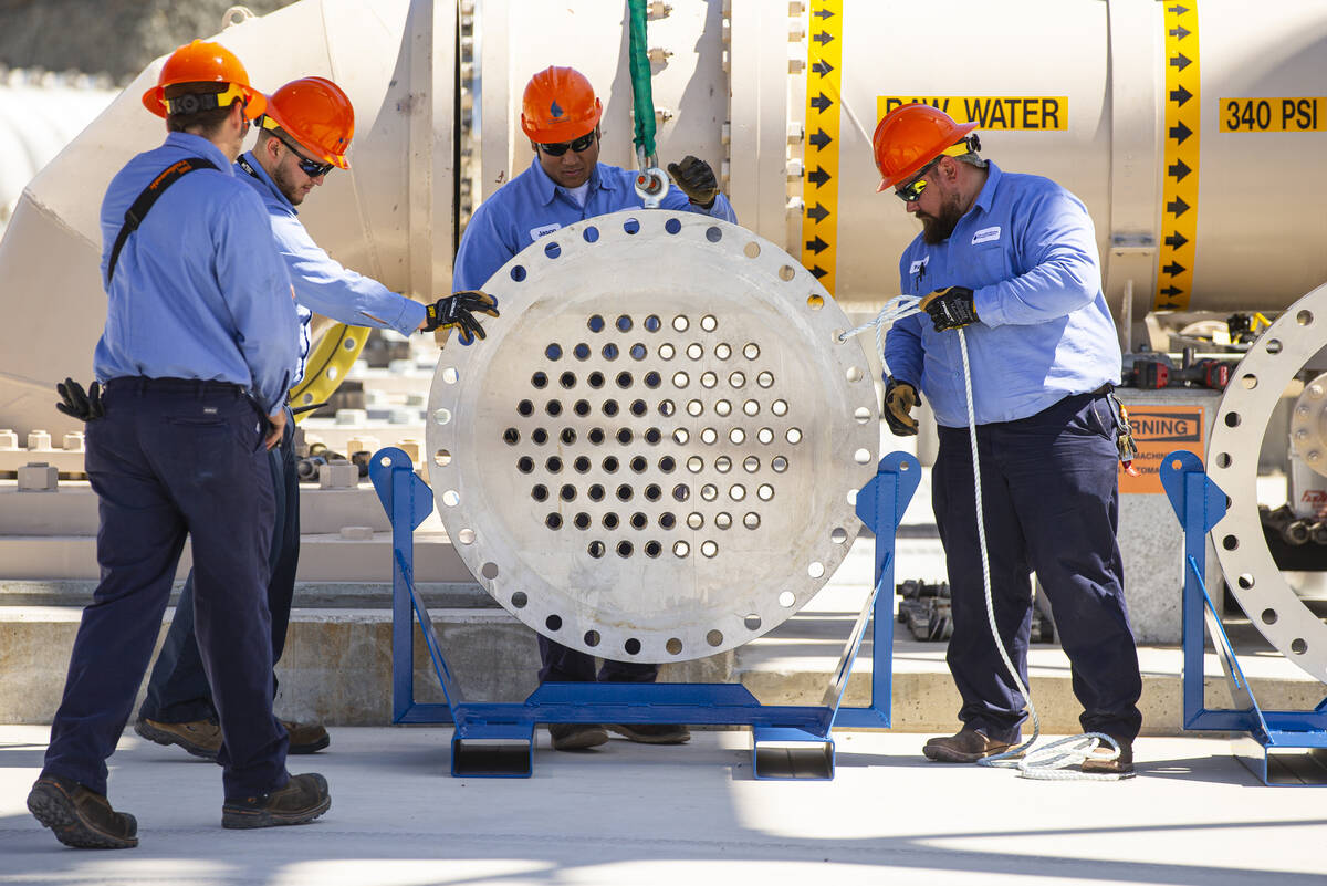 Southern Nevada Water Authority maintenance mechanics remove an energy dissipator before instal ...