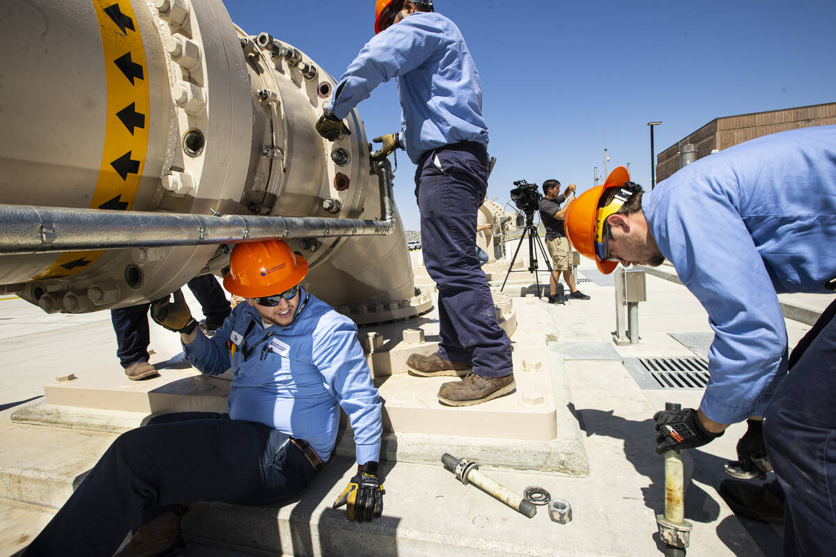 Southern Nevada Water Authority maintenance mechanics, from left, Tony Mercado, Jason Dondoy an ...