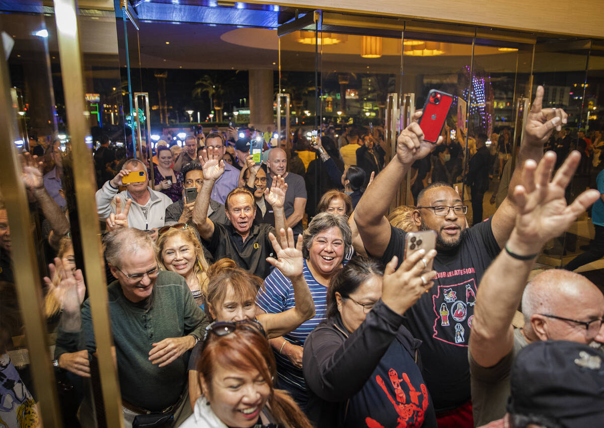 People walk into the Palms for the first time during the reopening on Wednesday, April 27, 2022 ...