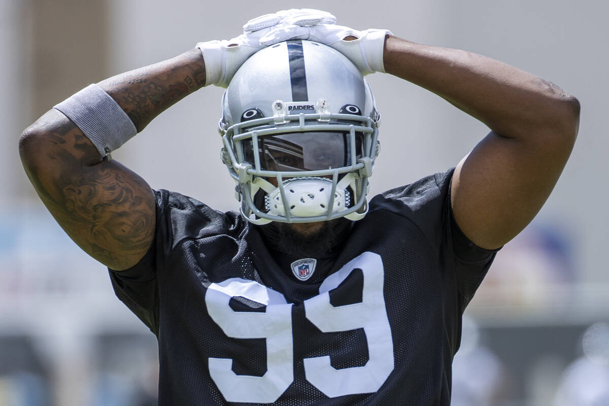 Defensive end Clelin Ferrell (99) grabs some air during a Las Vegas Raiders open practice at th ...