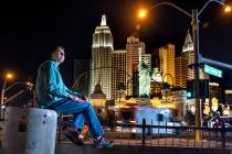 Benny poses for a photo along the Strip from atop a pedestrian bridge near the Excalibur on Fri ...