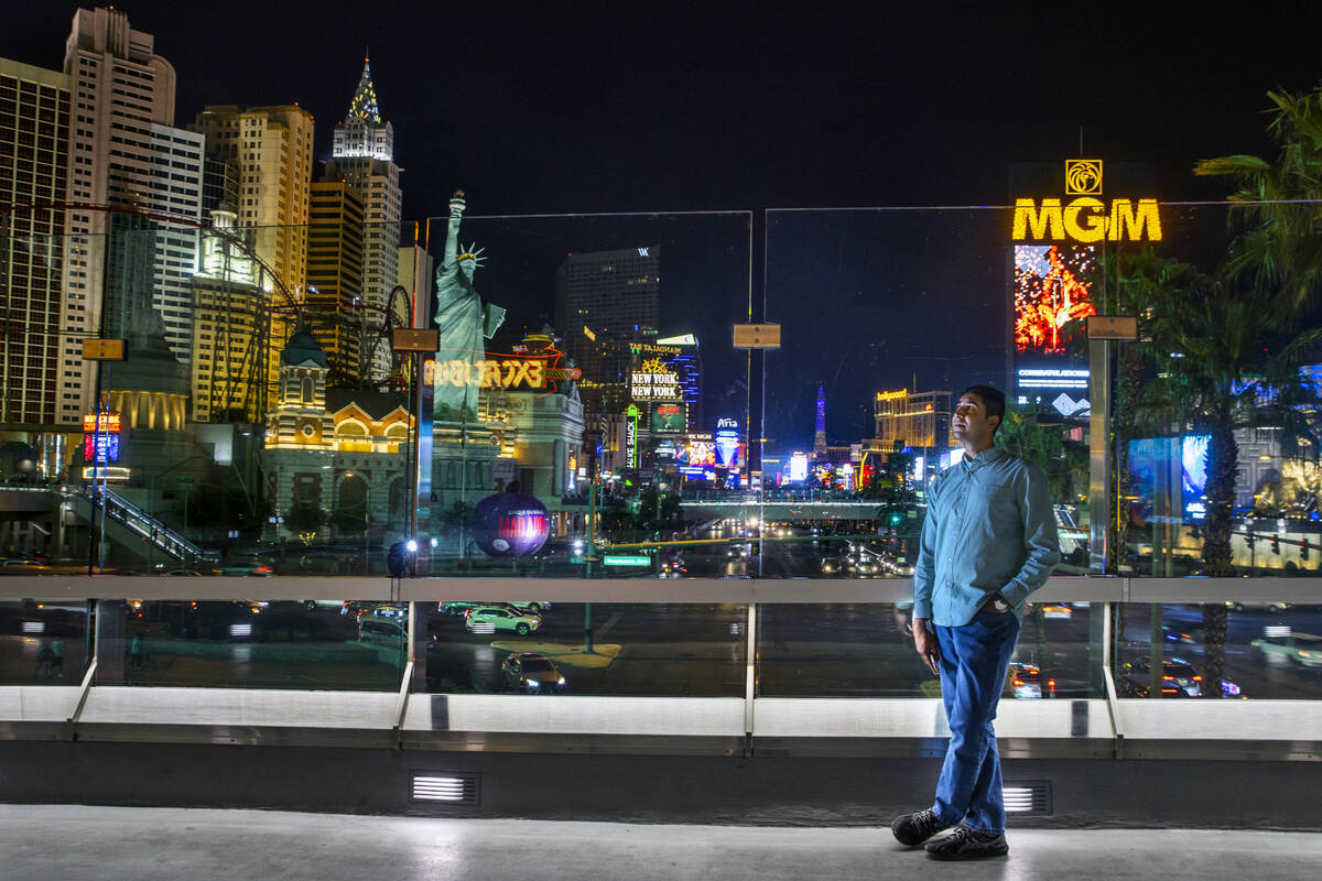 Benny poses for a photo along the Strip from atop a pedestrian bridge near the Excalibur on Fri ...