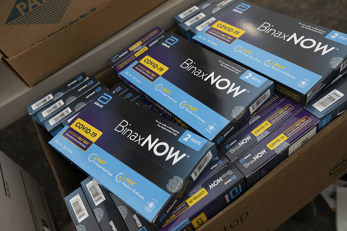 COVID-19 test kits ready for distribution. (Dave Zajac /Record-Journal via AP)