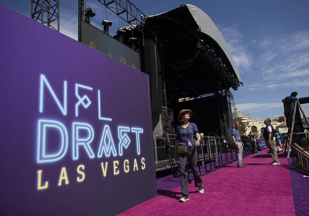 Workers continue to build the NFL draft red carpet stage at the Bellagio Fountains on Tuesday, ...