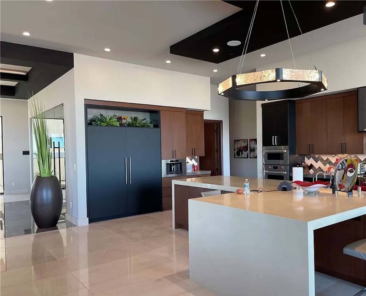 The gourmet kitchen has plenty of cabinet and counter space. (Sun West Custom Homes)