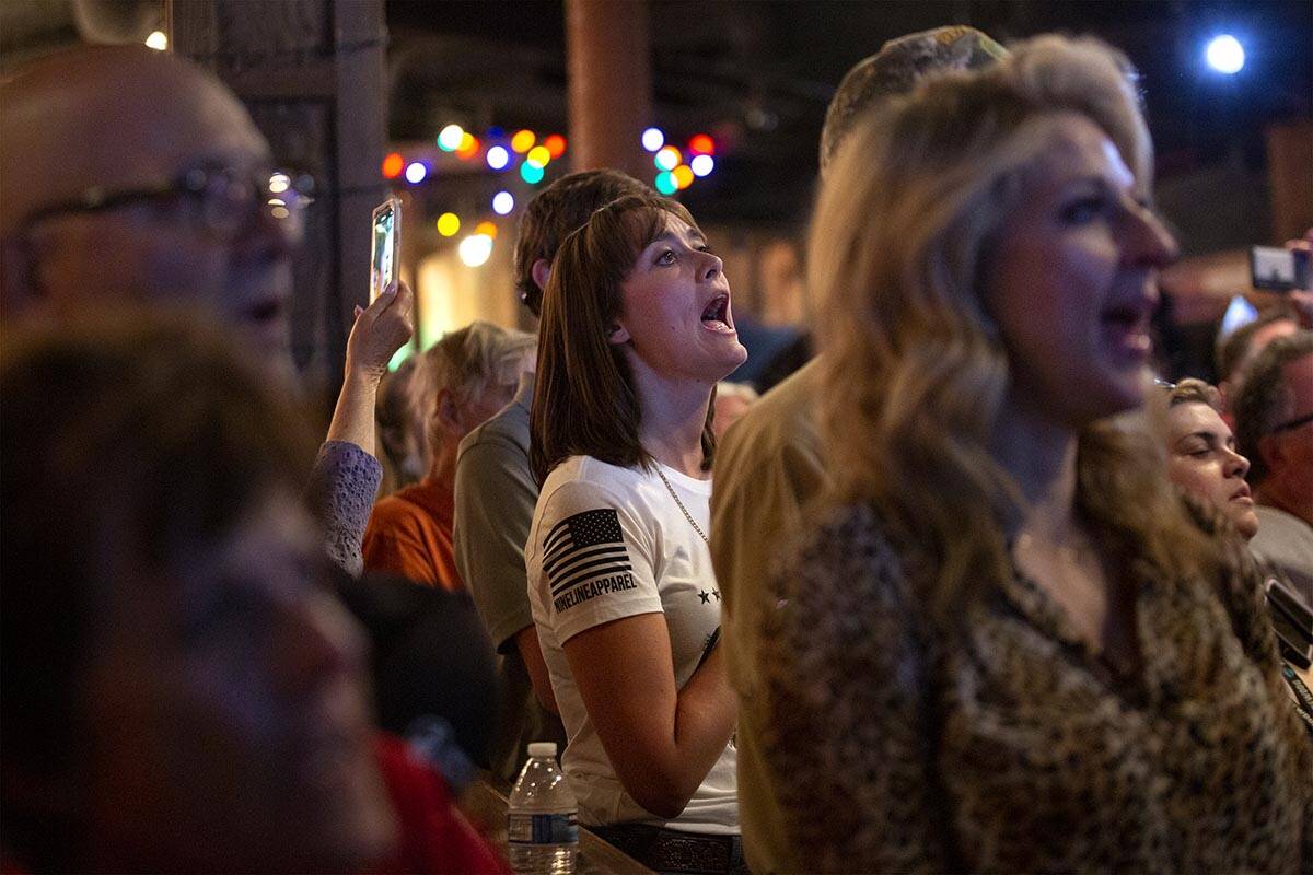 Audience members sing the national anthem during a rally for Nevada Republican U.S. Senate cand ...