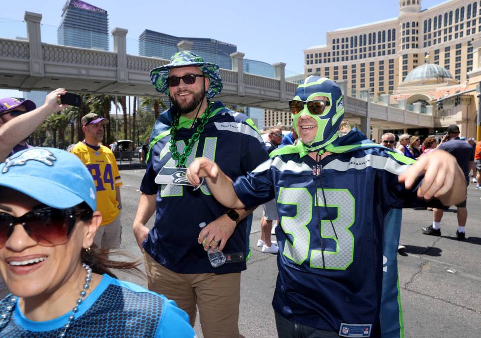 Marcus Norman, left, and Chris Findley, both of Tampa, Fla. on the closed Strip in front of the ...