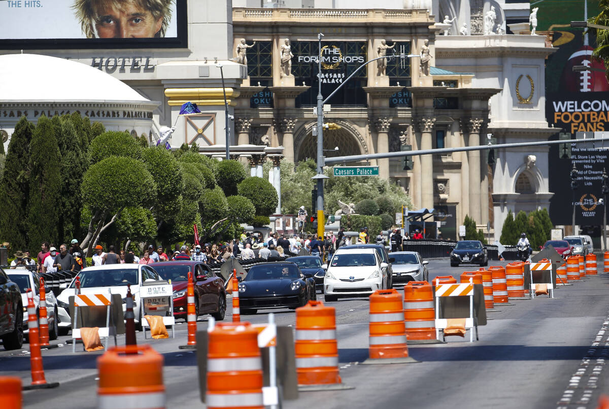 Vehicles drive along Las Vegas Boulevard north of Flamingo Road during the first day of the NFL ...