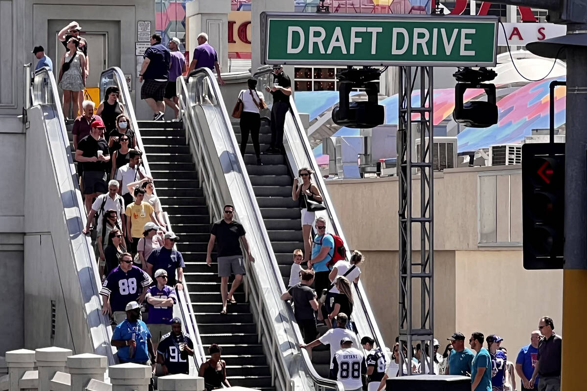 Fans ride an escalator on Las Vegas Boulevard, Thursday, April 28, 2022, in Las Vegas. After a ...
