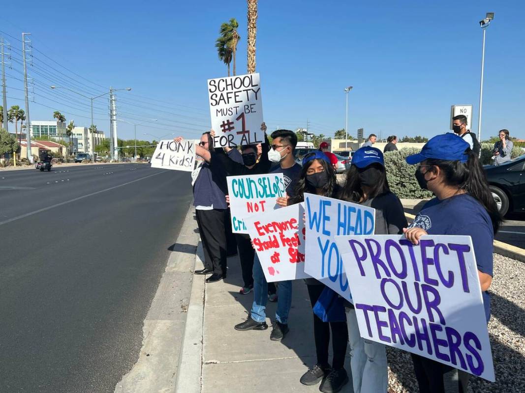 Two dozen educators, students and community members gather outside the Clark County School Dist ...